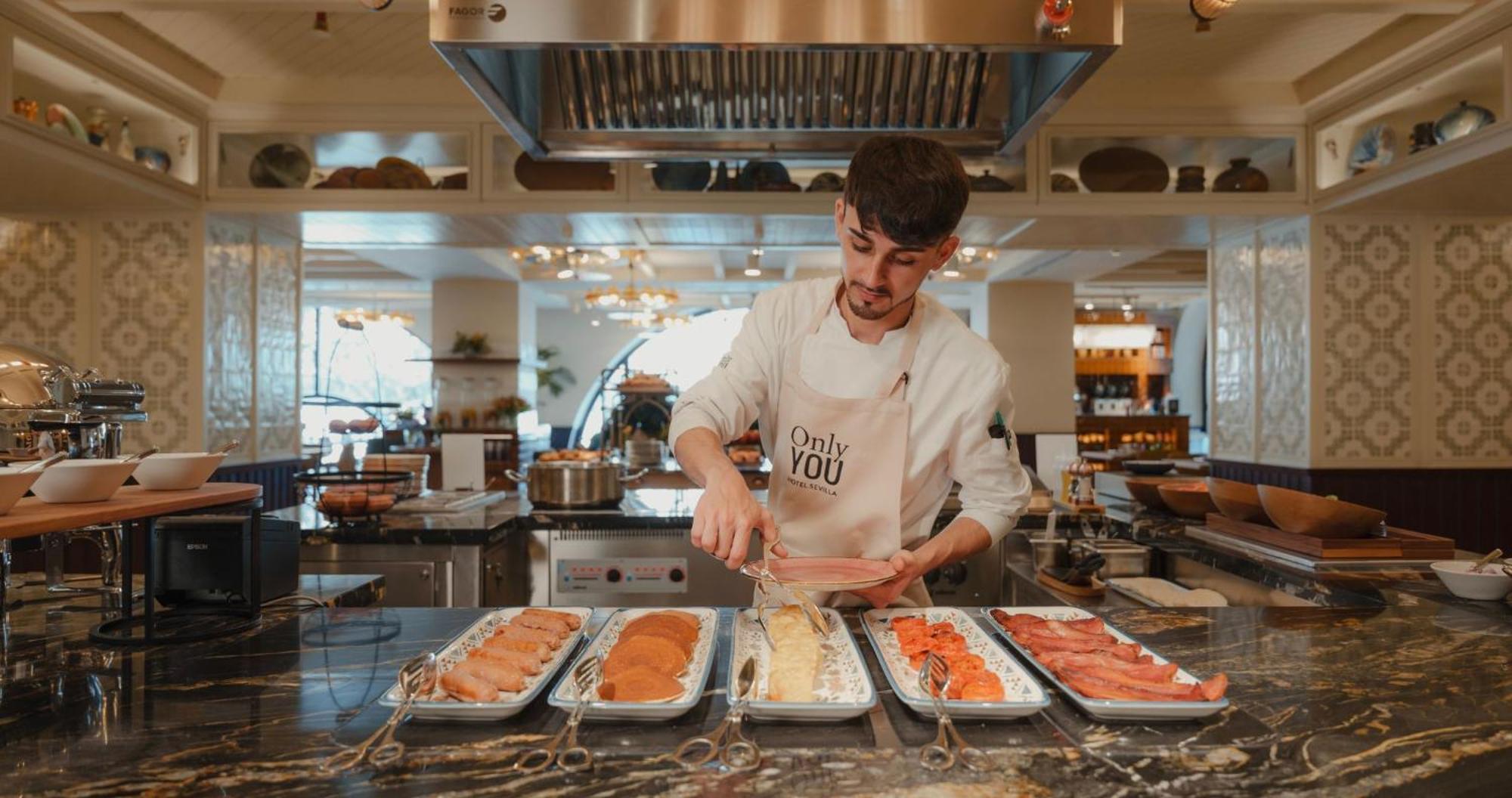 Only You Hotel Sevilla Exterior photo A chef preparing food