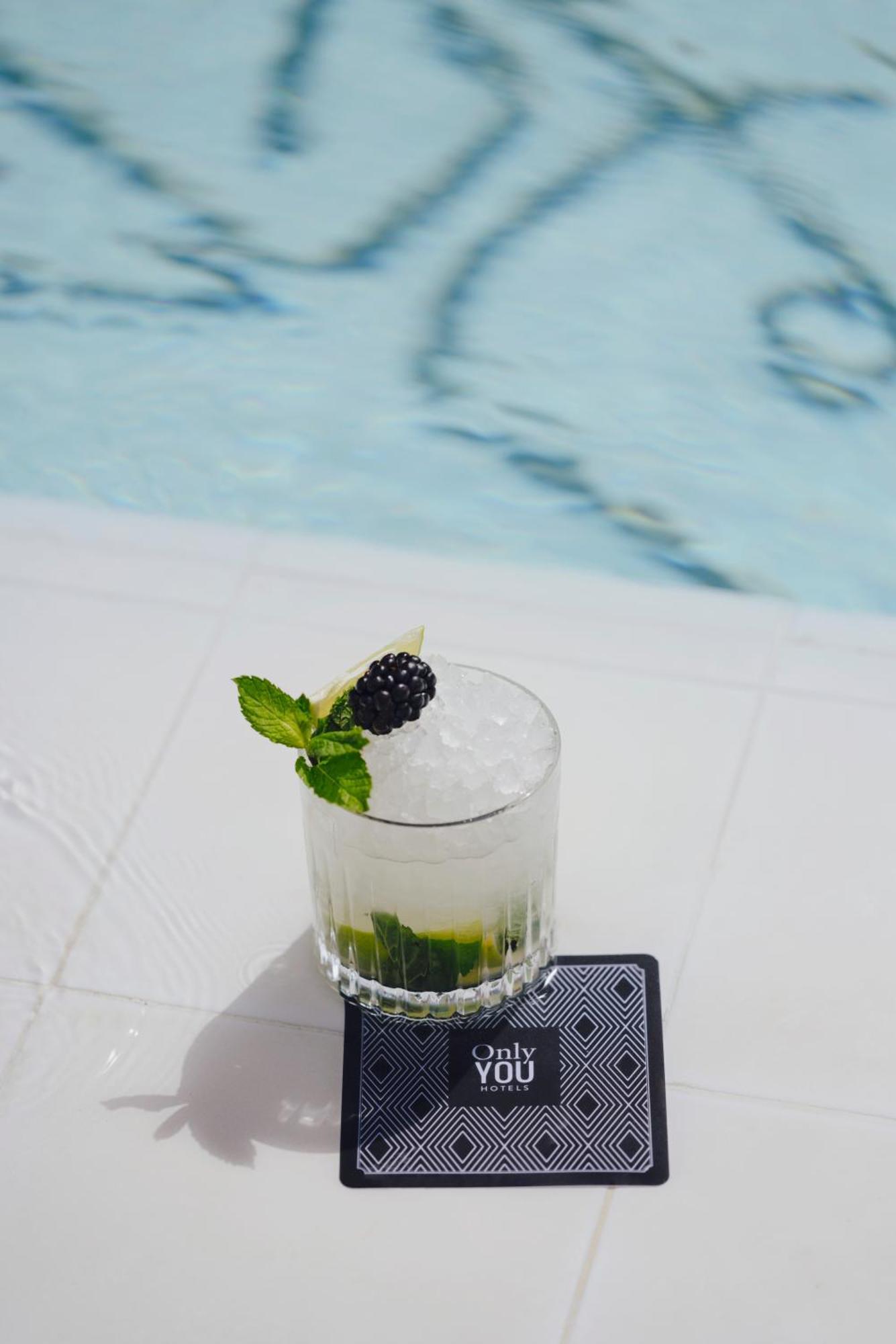 Only You Hotel Sevilla Exterior photo A blackberry gin and tonic